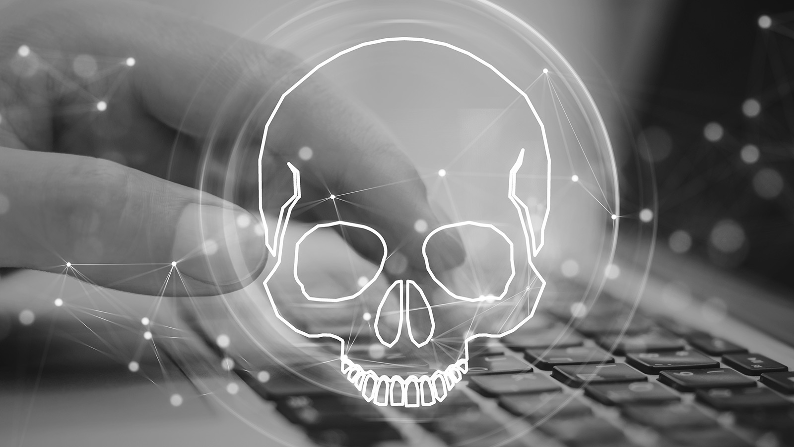 skull warning over laptop